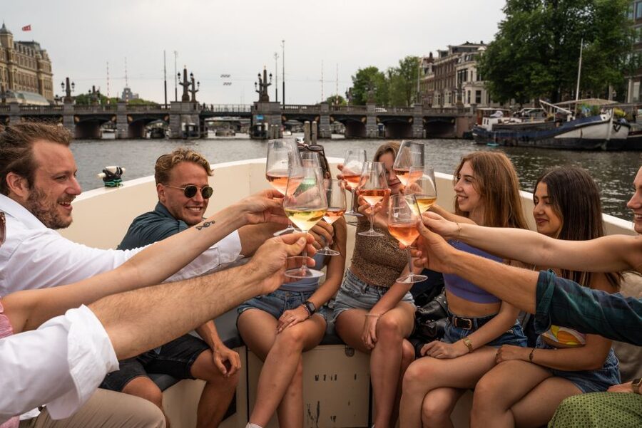 Amsterdam: Private Canal Booze Cruise with Unlimited Drinks - The Route: Red Light District to Seven Bridges Views
