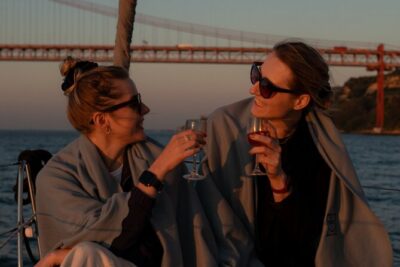 Lisbon Sunset Boat Cruise Tour With Drinks Included - Alfama, São Jorge, and the cathedral hill—seen from below