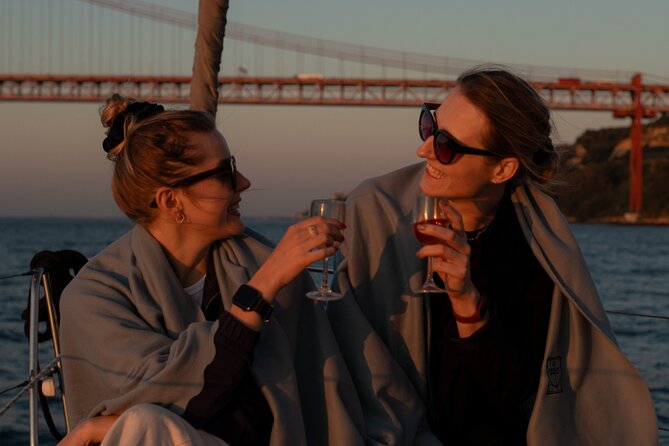 Lisbon Sunset Boat Cruise Tour With Drinks Included - Alfama, São Jorge, and the cathedral hill—seen from below