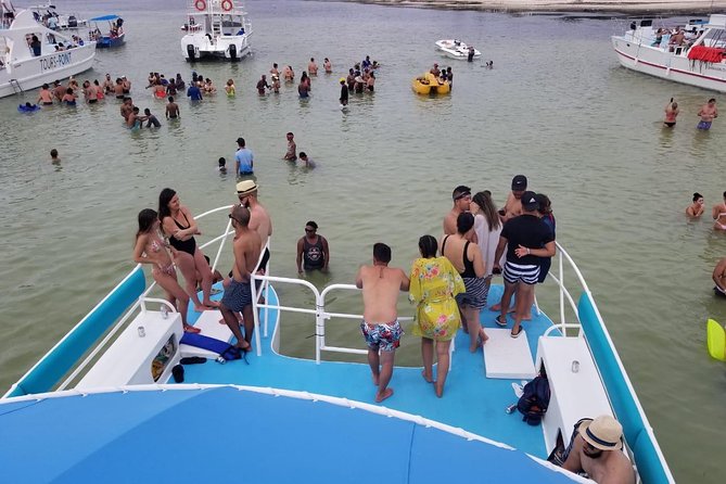 Party Boat in Punta Cana - Booze Cruse - Natural Pool stop: knee- to waist-deep swimming in a coral setting