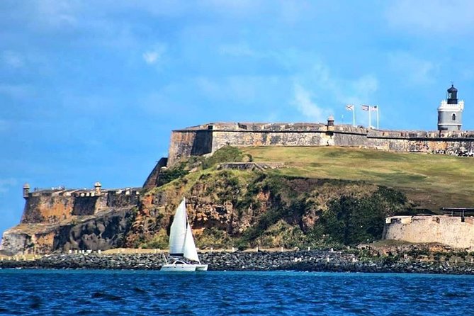 San Juan Catamaran Sunset Sail with Drinks Included - From the water: San Juan Gate, El Morro Fort, and the executive-mansion view