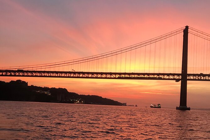 Sunset sailboat tour in Lisbon with green wine - Passing Under the Bridge Near the Pillars: Photo Moment, Real Tight Angle