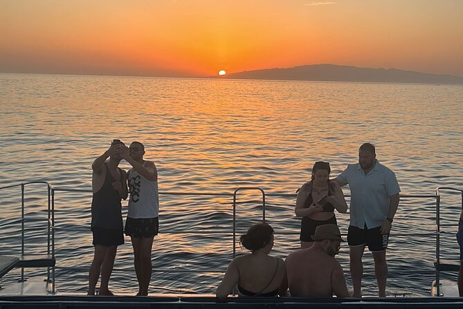 Tenerife Sunset Catamaran tour with transfer - Food and Drinks included. - The swim stop: bring swimwear, towel, and a change